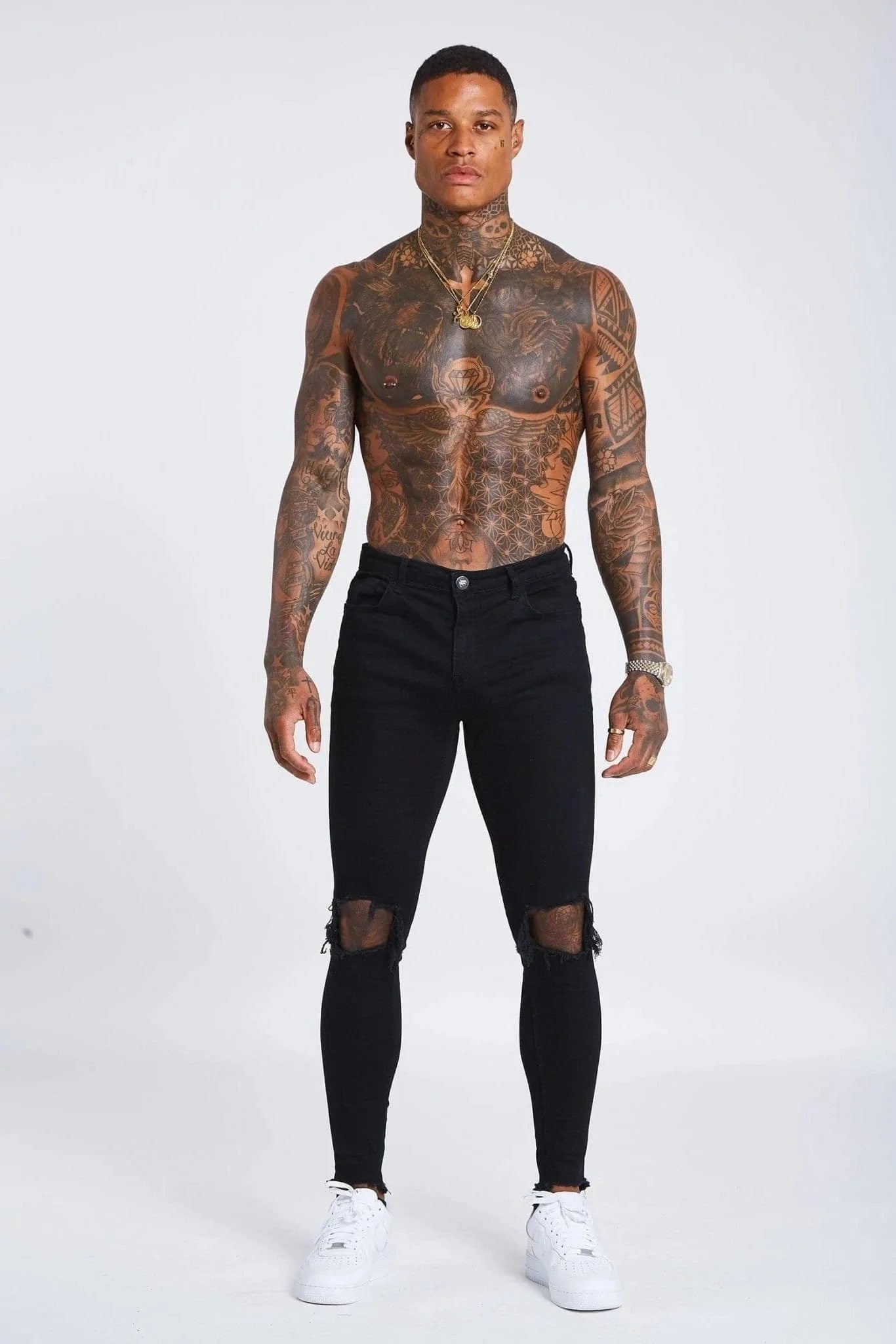 Jeans Skinny Negros con Desgastes en las Rodillas