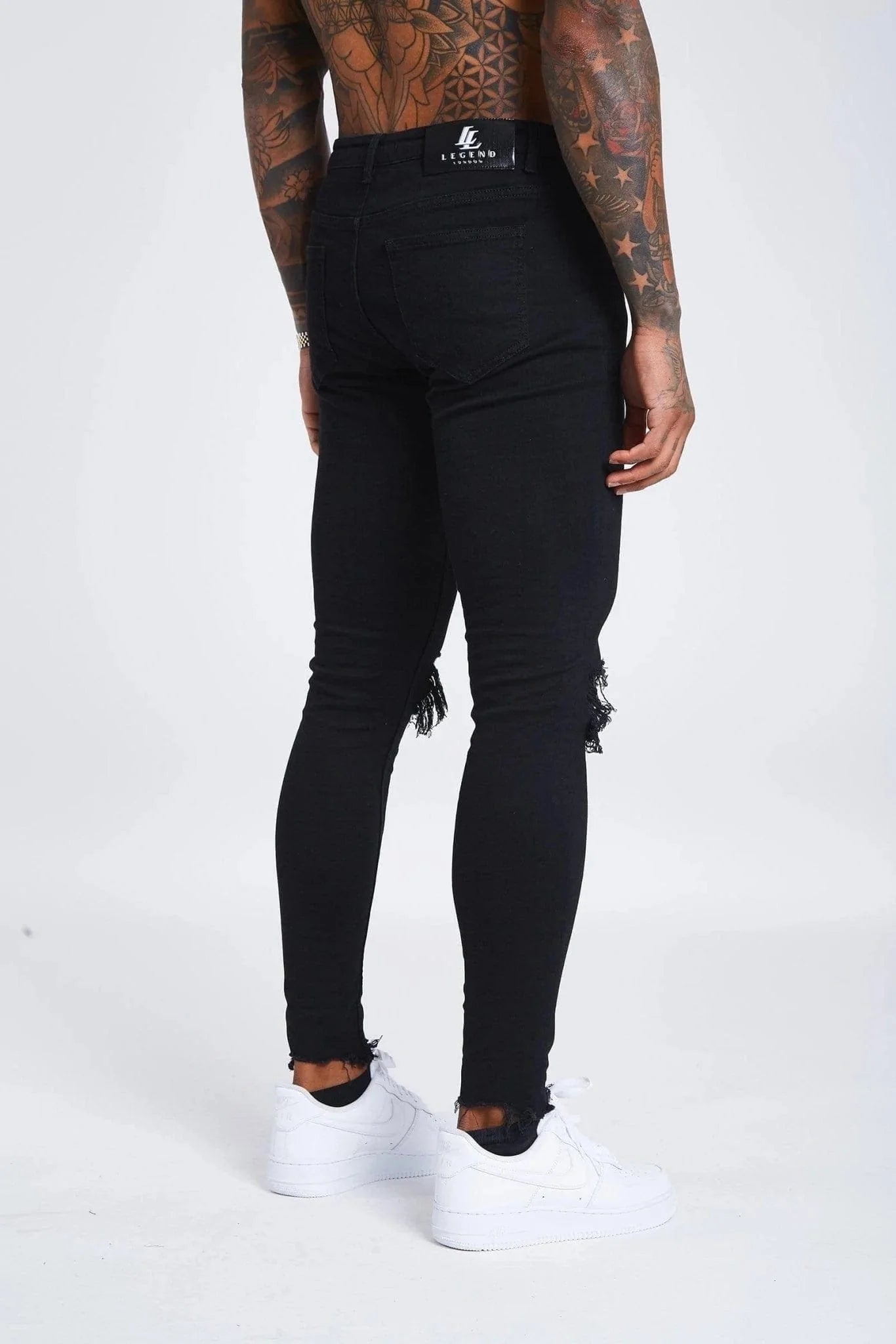 Jeans Skinny Negros con Desgastes en las Rodillas