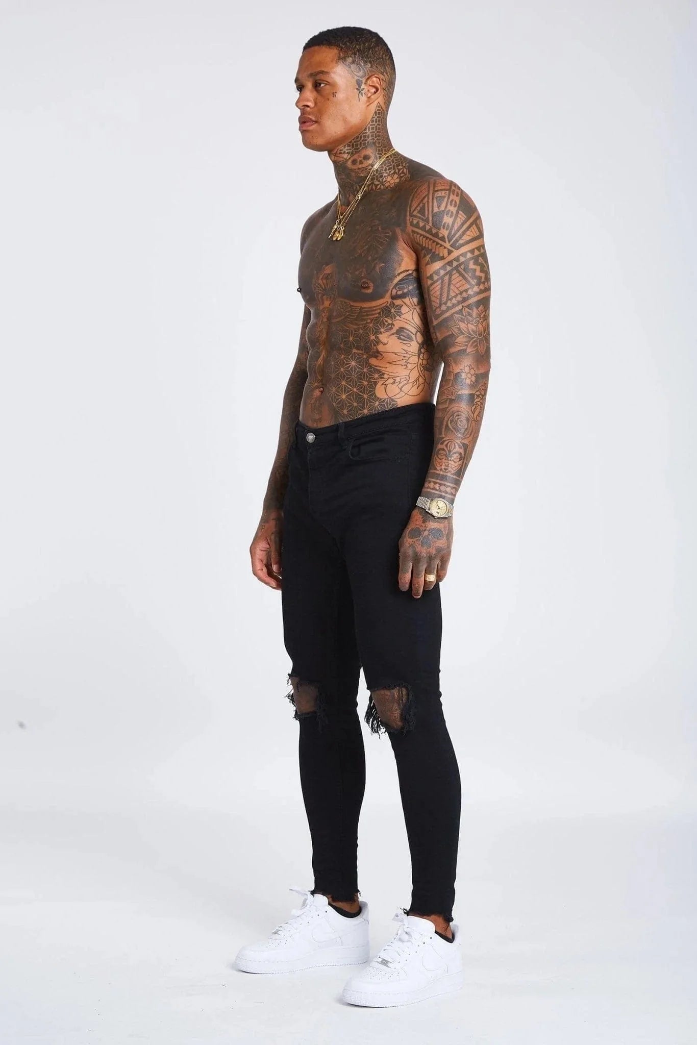 Jeans Skinny Negros con Desgastes en las Rodillas