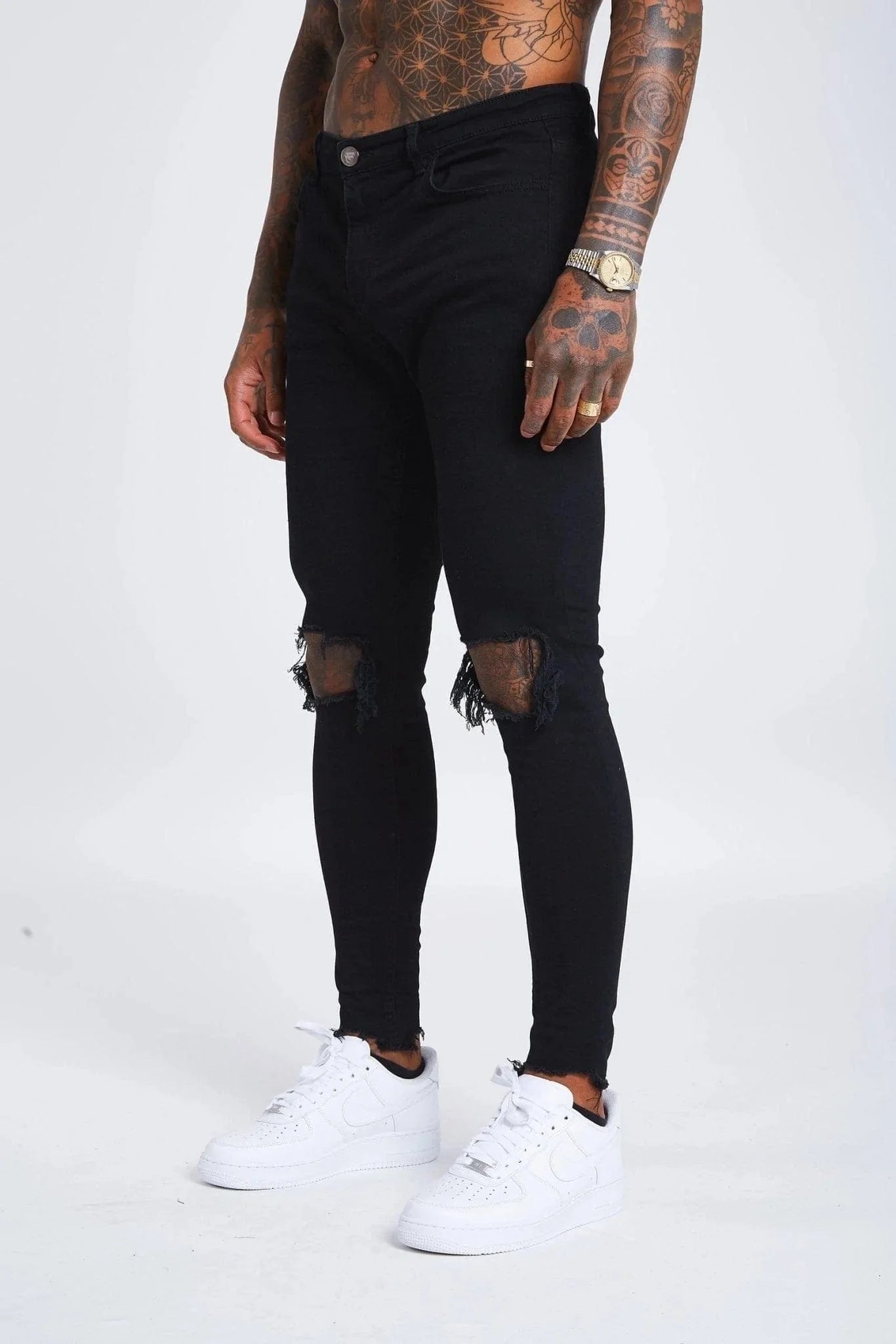Jeans Skinny Negros con Desgastes en las Rodillas