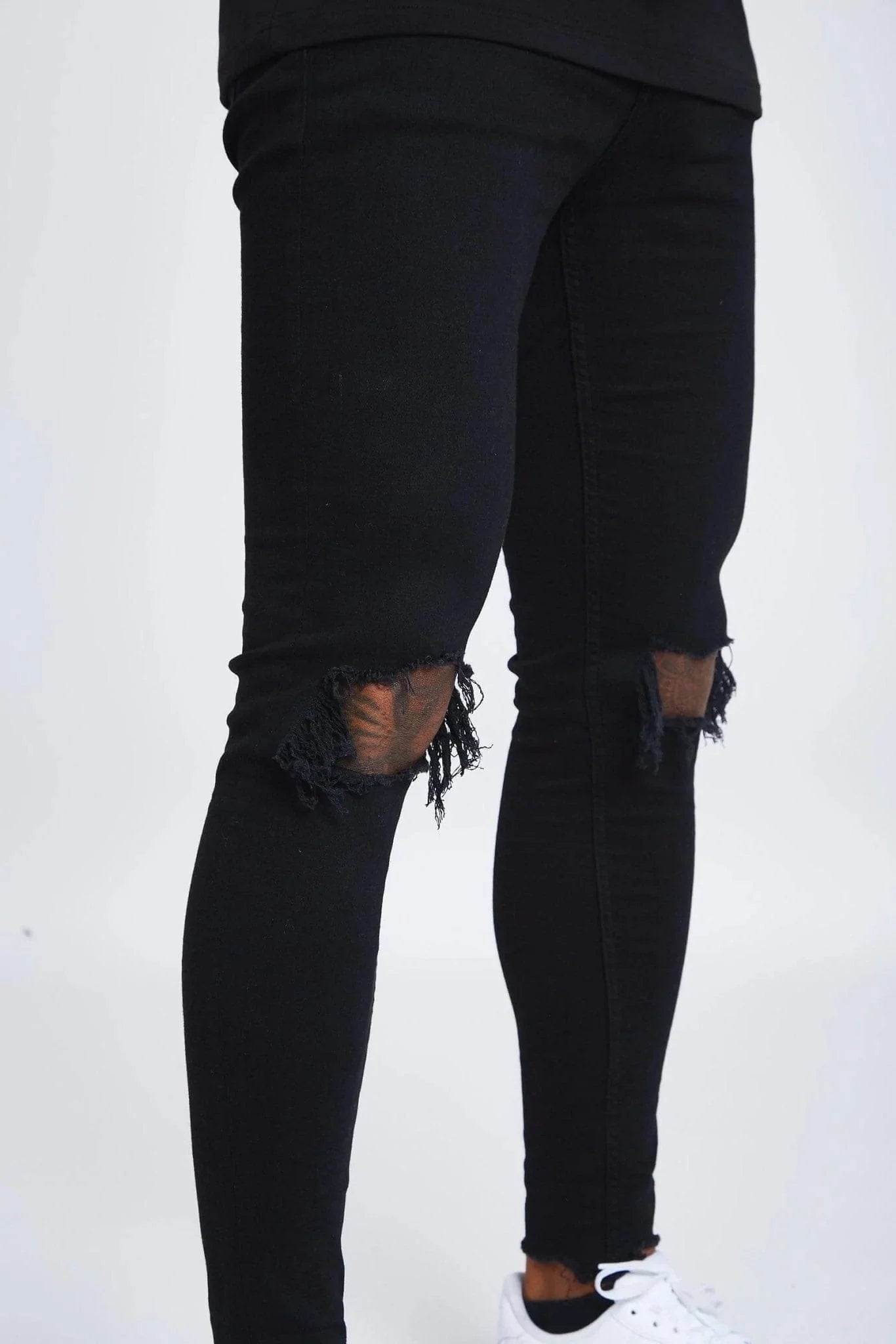 Jeans Skinny Negros con Desgastes en las Rodillas