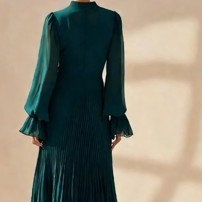 Vestido midi plisado elegante con detalles de volantes